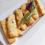 Rosemary and lavender shortbread on white serving plate